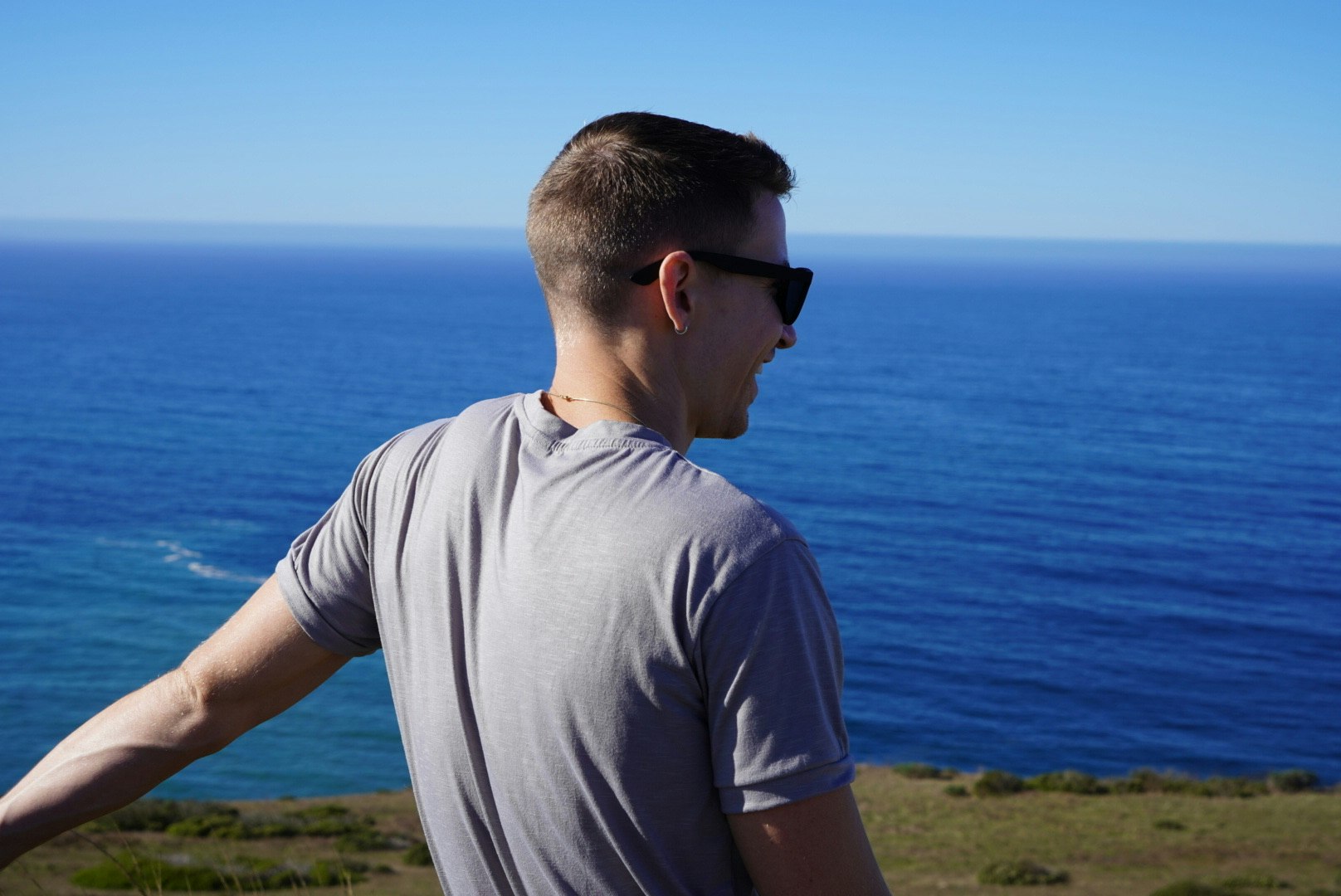 Photo of man enjoying the shoreline of Tomales Bay by @alivia