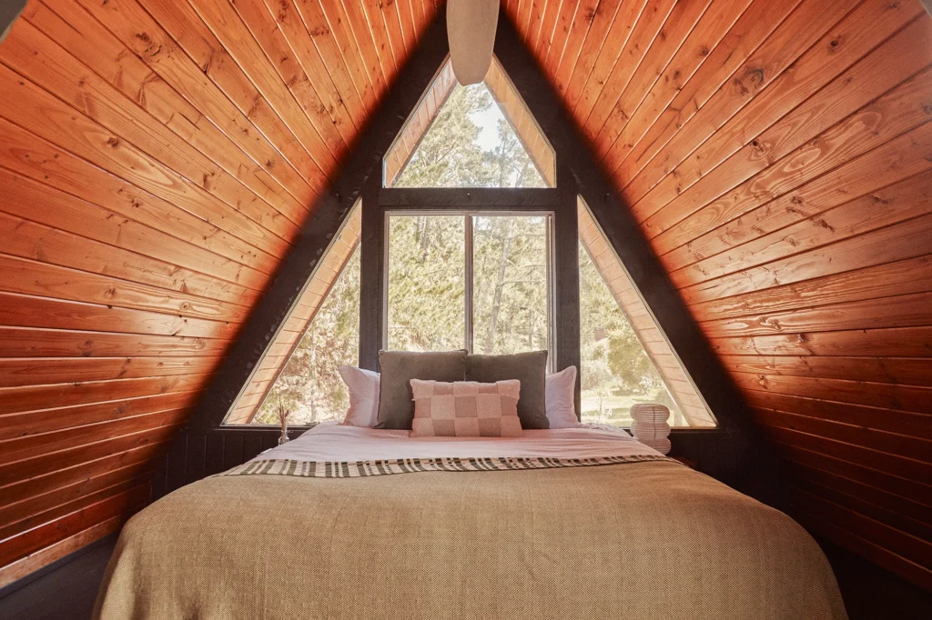 photo of bedroom in a-frame at lodge at marconi