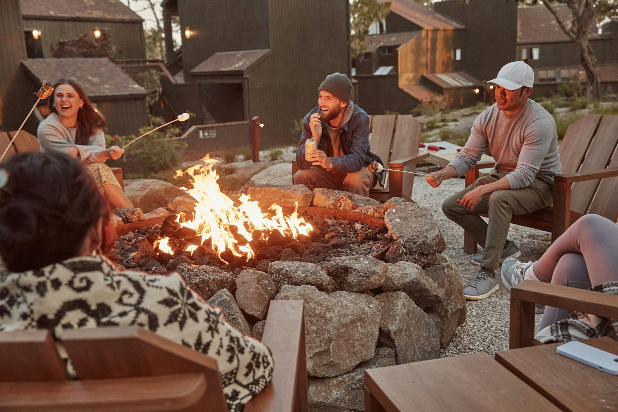 Photo of colleagues enjoying the fire pit and some conversation in Lodge at Marconi