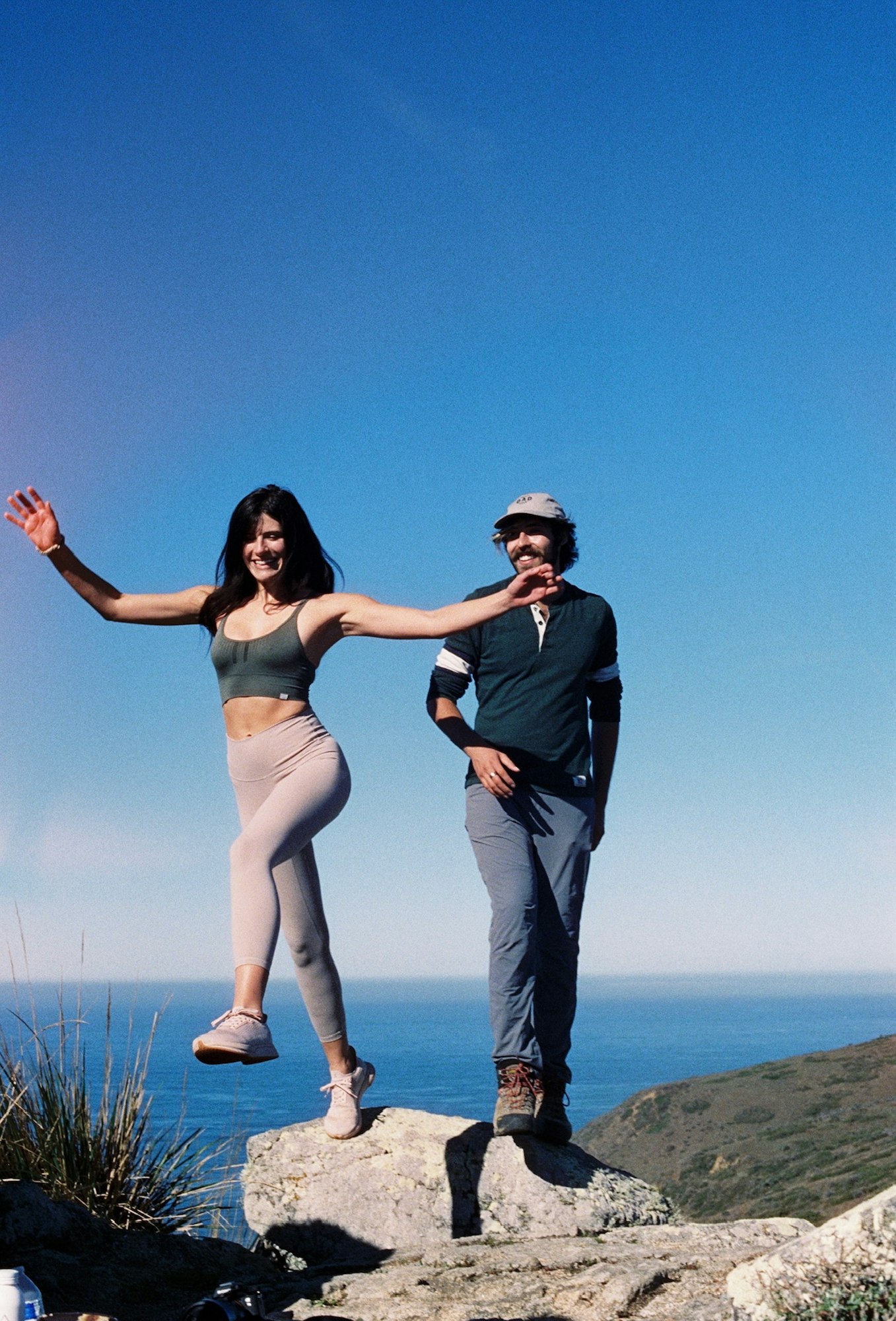 Photo of two people enjoying the shoreline of Tomales Bay