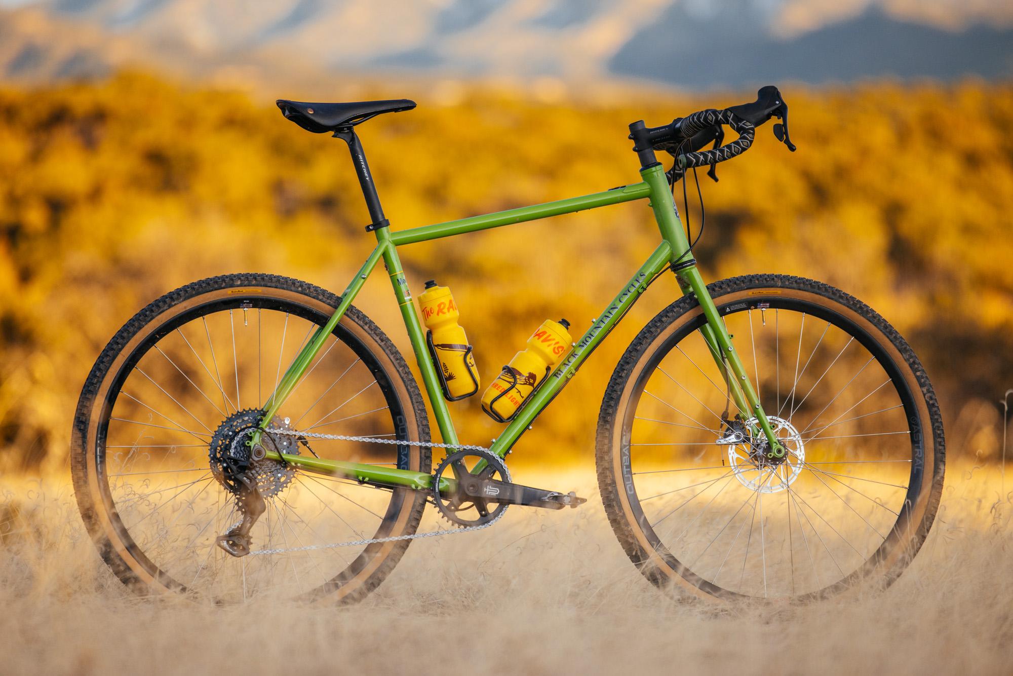 bicycle perched in front of scenic background at sunset